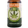 een fles cbd plus zittend op een wit oppervlak. miniatuur