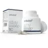 Een witte fles en doos met het label "Cibdol - CBD en CBN Stay Asleep Capsules (30 stuks)" met hop, 5-HTP en CBD-supplementen. De open fles bevat twee capsules aan de voorkant. miniatuur